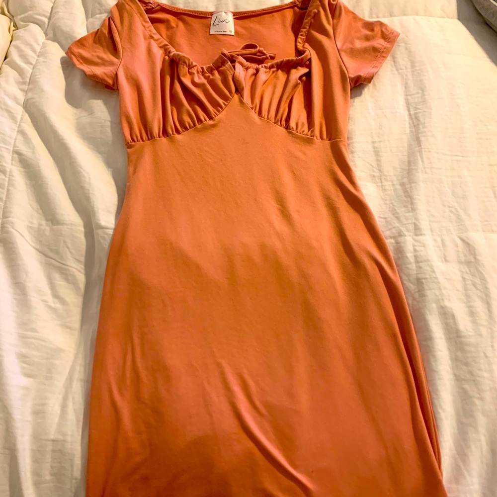 Light pink, slim fit dress.